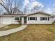 Charming single-story home featuring a white exterior, attached garage, and a well-maintained front yard at 1665 Ridgeview Nw Dr, Conyers, GA 30012