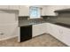 Functional kitchen features white cabinets, dark countertops, and appliances at 1665 Ridgeview Nw Dr, Conyers, GA 30012