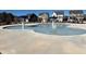 The community's pool for is surrounded by concrete and features two fountains in the middle at 428 Madison Lakeview Dr, Acworth, GA 30102