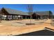 Exterior view of a community pool house with gray shingles and concrete paths at 428 Madison Lakeview Dr, Acworth, GA 30102