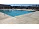 The community's rectangular pool is surrounded by concrete and features stairs for easy access at 428 Madison Lakeview Dr, Acworth, GA 30102
