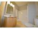 Bright bathroom with vanity, mirror and tub at 4879 Pinnacle Dr, Stone Mountain, GA 30088