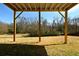 Spacious backyard beneath the deck featuring wooden support beams and an expansive outdoor nature space at 900 King Rd, Jonesboro, GA 30236