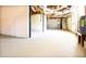 Open basement featuring cement flooring, unfinished walls, and access to the home's utilities at 900 King Rd, Jonesboro, GA 30236