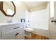Clean bathroom with white vanity, tub, and shower combination at 900 King Rd, Jonesboro, GA 30236
