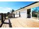 Spacious wood deck with metal and wood railing and sliding door access to the home at 900 King Rd, Jonesboro, GA 30236