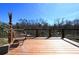 Relaxing deck with wood flooring, chair set, and a view of the serene outdoor nature space at 900 King Rd, Jonesboro, GA 30236