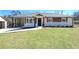 Charming renovated ranch-style home featuring white painted brick, a covered parking area and a well-manicured lawn at 900 King Rd, Jonesboro, GA 30236