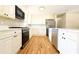 Bright kitchen featuring stainless steel appliances, white cabinetry, and ample counter space at 900 King Rd, Jonesboro, GA 30236