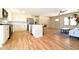 Open-concept kitchen with stainless steel appliances and seating island that joins the living room at 900 King Rd, Jonesboro, GA 30236