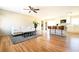 Open-concept living space with hardwood floors, modern seating, a breakfast bar, and a seamless flow to the kitchen at 900 King Rd, Jonesboro, GA 30236