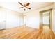 Light and airy main bedroom featuring hardwood floors and an attached bathroom at 900 King Rd, Jonesboro, GA 30236