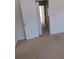 Bedroom with carpet, white trim, and a six-panel door at 770 Parkway Rd, Union City, GA 30291