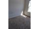 Cozy bedroom with neutral walls, carpet, and natural light from window at 770 Parkway Rd, Union City, GA 30291