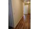 Hallway featuring modern laminate flooring and neutral-toned walls at 770 Parkway Rd, Union City, GA 30291
