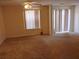 Spacious living room with neutral carpet and sliding glass doors at 770 Parkway Rd, Union City, GA 30291