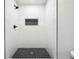 Modern shower features white tile, hexagon floor and matte black plumbing fixtures at 2977 Heritage Villas Dr, Lithonia, GA 30038