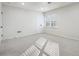 Bright bedroom features neutral carpet, crisp white walls, and a double window for great natural light at 2977 Heritage Villas Dr, Lithonia, GA 30038