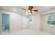 Bright bedroom with carpet, ceiling fan, and ensuite bathroom with a toilet at 2977 Heritage Villas Dr, Lithonia, GA 30038