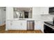 Kitchen with stainless steel appliances, marble countertops and view into the living room at 2977 Heritage Villas Dr, Lithonia, GA 30038