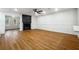 Spacious living room with wood floors, a ceiling fan, and a cozy fireplace at 2977 Heritage Villas Dr, Lithonia, GA 30038