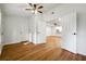 Bright living room with hardwood floors, white walls, ceiling fan and open doorway at 2977 Heritage Villas Dr, Lithonia, GA 30038