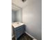 Stylish bathroom vanity with sleek countertop and modern gray cabinetry at 3125 Colonial Way # H, Atlanta, GA 30341