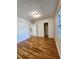 Sunlit bedroom features gleaming hardwood floors and ample closet space at 3125 Colonial Way # H, Atlanta, GA 30341
