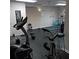 Home gym with ceiling fan, wall mirror, and an assortment of fitness equipment at 3125 Colonial Way # H, Atlanta, GA 30341
