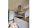 Bright kitchen features butcher block countertops, white cabinetry, and modern appliances at 3125 Colonial Way # H, Atlanta, GA 30341