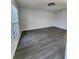 Bright living room boasts hardwood floors and plenty of natural light from the window at 3125 Colonial Way # H, Atlanta, GA 30341