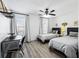 Bedroom featuring two twin beds, desk area, and neutral decor at 1514 Park Grove Dr, Lawrenceville, GA 30046