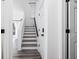 Hallway with stairs and light colored hardwood floors at 1514 Park Grove Dr, Lawrenceville, GA 30046