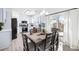 Bright, eat-in kitchen featuring white cabinets, stainless steel appliances, and sliding glass doors to the outside at 1514 Park Grove Dr, Lawrenceville, GA 30046