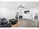 Bright living room with stylish gray floors, modern fireplace, and a comfortable seating area at 1514 Park Grove Dr, Lawrenceville, GA 30046