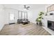 Inviting living room with light floors, a cozy seating arrangement, and a decorative fireplace at 1514 Park Grove Dr, Lawrenceville, GA 30046