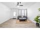Spacious living room featuring wood-look floors, neutral decor, and a bright, airy feel at 1514 Park Grove Dr, Lawrenceville, GA 30046