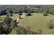A beautiful home surrounded by lush green fields and mature trees at 1525 Thomas Rd, Canton, GA 30115