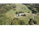 A well-maintained home with a pool and a winding driveway through green pastures at 1525 Thomas Rd, Canton, GA 30115