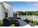 Charming backyard entrance with stone pathway, lush landscaping, and gated access to the pool area at 1525 Thomas Rd, Canton, GA 30115