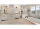 Beautiful bathroom with a soaking tub, glass shower, and double vanity with great lighting at 1525 Thomas Rd, Canton, GA 30115
