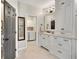 Bathroom featuring white cabinetry, granite counters, a soaking tub, and a separate shower at 1525 Thomas Rd, Canton, GA 30115