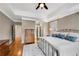 Bedroom featuring a tray ceiling, hardwood floors, and neutral walls at 1525 Thomas Rd, Canton, GA 30115