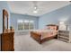 Cozy bedroom features soft carpet, a ceiling fan and a light blue color scheme creating a soothing retreat at 1525 Thomas Rd, Canton, GA 30115