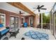 Inviting covered patio with brick details, cozy seating, and outdoor access to the expansive backyard at 1525 Thomas Rd, Canton, GA 30115
