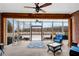 Bright and airy covered patio with wood beams, ceiling fans and view of spacious back yard at 1525 Thomas Rd, Canton, GA 30115