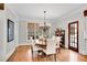 Bright dining room with hardwood floors, large windows, and a stylish chandelier at 1525 Thomas Rd, Canton, GA 30115