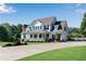 Charming two-story house with a white picket fence and well-manicured landscaping at 1525 Thomas Rd, Canton, GA 30115