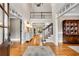 Grand foyer with hardwood floors, a staircase, and a view of the formal living room at 1525 Thomas Rd, Canton, GA 30115