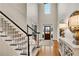 Grand foyer with high ceilings, staircase, and hardwood floors, creating a luxurious entrance at 1525 Thomas Rd, Canton, GA 30115
